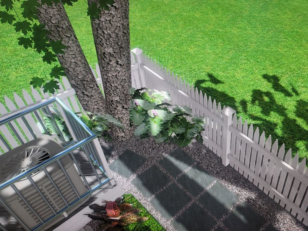 Aerial view of a garden with a tree, white picket fence, and greenery beside an air conditioning unit.