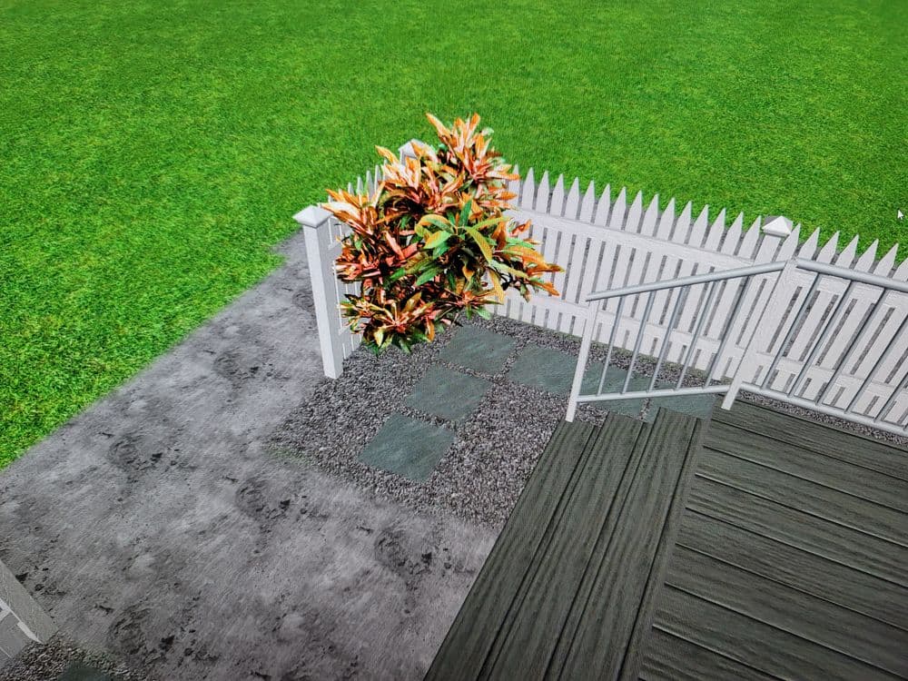 Vibrant plants near a white picket fence in a well-maintained backyard setting.